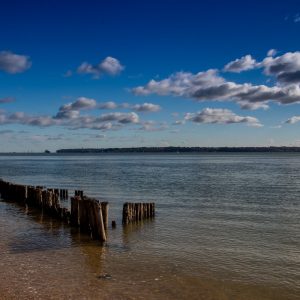 Clouds and posts at the seaside